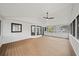 Spacious screened porch with wood decking and ceiling fan, perfect for relaxing at 425 Shepard Sw Dr, Marietta, GA 30064
