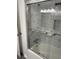 Updated bathroom with marble-look shower and glass door enclosure at 2540 Thornton Dr, Atlanta, GA 30349