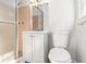 Neutral bathroom with a glass shower, a white vanity, and matching toilet at 2540 Thornton Dr, Atlanta, GA 30349