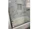 Stylish bathroom with decorative tiled shower niche and glass door at 2540 Thornton Dr, Atlanta, GA 30349