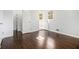 Bright bedroom featuring hardwood floors, fresh white walls, and a built-in closet at 2540 Thornton Dr, Atlanta, GA 30349