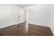 Bedroom with hardwood floors, closet, and a door leading to another room at 2540 Thornton Dr, Atlanta, GA 30349