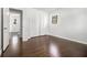 Light filled bedroom featuring hardwood floors, closet, and a window bringing in natural light at 2540 Thornton Dr, Atlanta, GA 30349