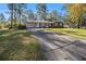 Lovely brick home with an attached carport and long driveway at 2540 Thornton Dr, Atlanta, GA 30349