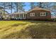 Beautiful brick home with green shutters and a well-maintained lawn at 2540 Thornton Dr, Atlanta, GA 30349