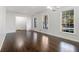 Sun-drenched living room showcasing hardwood floors and large picture windows at 2540 Thornton Dr, Atlanta, GA 30349