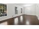 Bright living area with hardwood floors and large windows at 2540 Thornton Dr, Atlanta, GA 30349