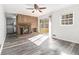 Inviting living room featuring a cozy brick fireplace and sliding glass doors to the backyard at 2540 Thornton Dr, Atlanta, GA 30349