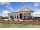 Brick house with a front porch and black metal fence, landscaped yard at 630 Pineberry Ct, Grayson, GA 30017