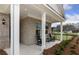 Inviting front porch with rocking chairs and brick facade at 630 Pineberry Ct, Grayson, GA 30017