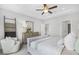 Main bedroom with plush carpet, large bed, and ample closet space at 630 Pineberry Ct, Grayson, GA 30017