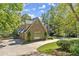 Stone and shingle exterior of house with driveway at 6080 Camelia Dr, Douglasville, GA 30135