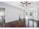 Spacious bedroom with dark hardwood floors and a ceiling fan at 3779 Churchill Sw Dr, Marietta, GA 30064