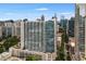 Aerial view showcasing a high-rise building's exterior and city backdrop at 860 Peachtree Ne St # 2605, Atlanta, GA 30308
