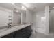 Modern bathroom with granite countertops and a bathtub at 860 Peachtree Ne St # 2605, Atlanta, GA 30308