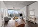 Modern dining area with wooden table and chairs, offering city views at 860 Peachtree Ne St # 2605, Atlanta, GA 30308