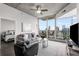 Modern living room with city view, hardwood floors, and comfortable seating at 860 Peachtree Ne St # 2605, Atlanta, GA 30308