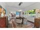 Bright dining room with round table, four chairs, and large window at 4152 Club Dr, Atlanta, GA 30319