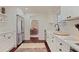 Modern kitchen with white cabinets, stainless steel appliances, and a farmhouse sink at 485 Tanacrest Dr, Atlanta, GA 30328