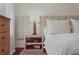 Wooden nightstand with lamp and books in bedroom at 485 Tanacrest Dr, Atlanta, GA 30328