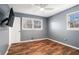 Minimalist bedroom featuring wood floors, lots of natural light, and neutral walls at 554 Briggs Sw Cir, Lilburn, GA 30047