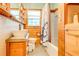 Updated bathroom with wood features and a modern vanity at 1576 Temple Ave, Atlanta, GA 30337