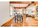 Charming dining area with hardwood floors and a view into the kitchen at 1576 Temple Ave, Atlanta, GA 30337