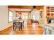 View of the dining area and kitchen with exposed wooden beams at 1576 Temple Ave, Atlanta, GA 30337