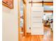 White 5-panel barn door adds charm to hallway, offering a view of the kitchen at 1576 Temple Ave, Atlanta, GA 30337