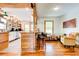 Open concept kitchen with a breakfast bar and seating area at 1576 Temple Ave, Atlanta, GA 30337