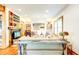 Bright living room with hardwood floors, comfy seating, and built-in shelves at 1576 Temple Ave, Atlanta, GA 30337