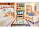 Living room with eclectic decor, hardwood floors, and built-in shelving at 1576 Temple Ave, Atlanta, GA 30337