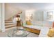 Cozy basement sitting area with sectional sofa and glass coffee table at 1020 W Wesley Nw Rd, Atlanta, GA 30327