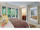 Spacious bedroom with access to a sitting area and additional rooms at 1020 W Wesley Nw Rd, Atlanta, GA 30327