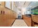 Long hallway with built-in storage and access to laundry and other rooms at 1020 W Wesley Nw Rd, Atlanta, GA 30327