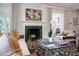 Elegant living room with a marble fireplace and comfortable seating at 1020 W Wesley Nw Rd, Atlanta, GA 30327
