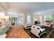 Spacious living room featuring hardwood floors and ample natural light at 1020 W Wesley Nw Rd, Atlanta, GA 30327