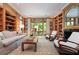 Spacious living room with built-in bookshelves and a cozy sitting area at 1020 W Wesley Nw Rd, Atlanta, GA 30327