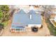 House roof with gray shingles, backyard deck, and trampoline at 1584 Heartwood Dr, Lawrenceville, GA 30043