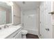 Clean bathroom with white vanity, tub and shower combo, and updated fixtures at 3446 Newberry Trl, Decatur, GA 30034