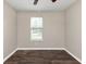 Simple bedroom with wood floors and a window with blinds at 3446 Newberry Trl, Decatur, GA 30034