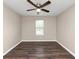 Bright bedroom featuring wood floors and a ceiling fan at 3446 Newberry Trl, Decatur, GA 30034