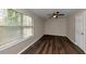 Spacious bedroom with hardwood floors and large window at 3446 Newberry Trl, Decatur, GA 30034