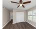 Bedroom with wood floors, large closet, and ceiling fan at 3446 Newberry Trl, Decatur, GA 30034