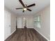 Bright bedroom with hardwood floors, ceiling fan, and ample closet space at 3446 Newberry Trl, Decatur, GA 30034