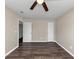 Well-lit bedroom with wood floors and multiple doors at 3446 Newberry Trl, Decatur, GA 30034