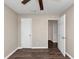 Empty bedroom with wood floors, ceiling fan, and doors at 3446 Newberry Trl, Decatur, GA 30034