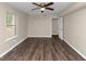 Spacious bedroom with hardwood floors and large window at 3446 Newberry Trl, Decatur, GA 30034