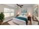 Bright bedroom with wood floors, window, and ceiling fan at 3446 Newberry Trl, Decatur, GA 30034
