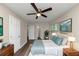 Spacious bedroom with wood floors, ceiling fan, and lots of natural light at 3446 Newberry Trl, Decatur, GA 30034